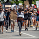Demonstrators raise signs in the air in protest over the murder of George Floyd and other victims of police brutality, on Friday, June 12, 2020, in Cincinnati, Ohio.